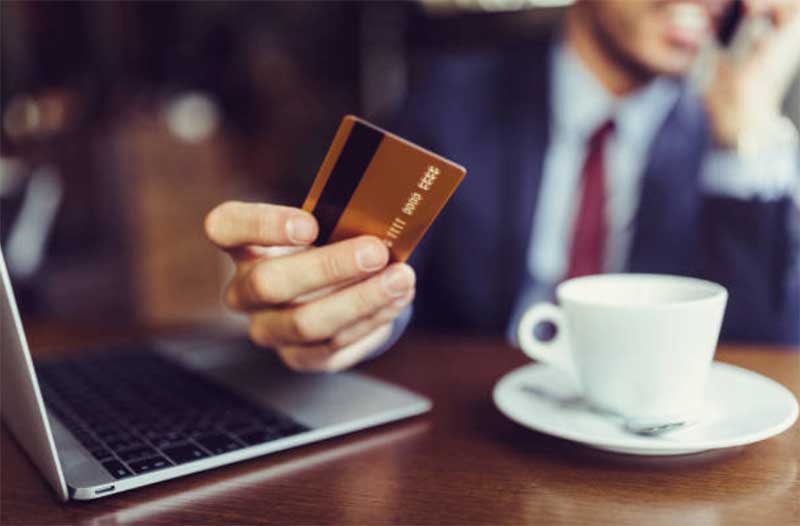 Business man paying with credit card